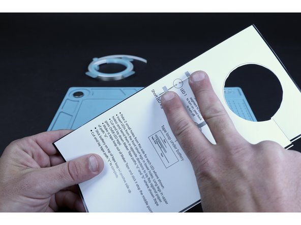 Flip your project over to the circuits side. Bend the LED legs in the directions shown on the diagram so they lay flat against the paper.