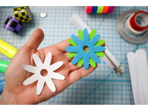Choose an embellishment from the template and cut it out of foam, felt, paper, or fabric. Glue it over the LED(s).