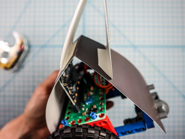 Adhere the head to the body as shown.