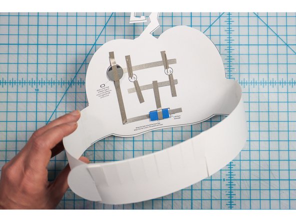 Interlock the slits in two places to create the size that works for your head. 