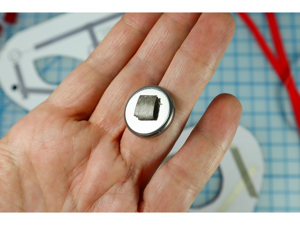 Make a small loop of Maker Tape with the adhesive side out.