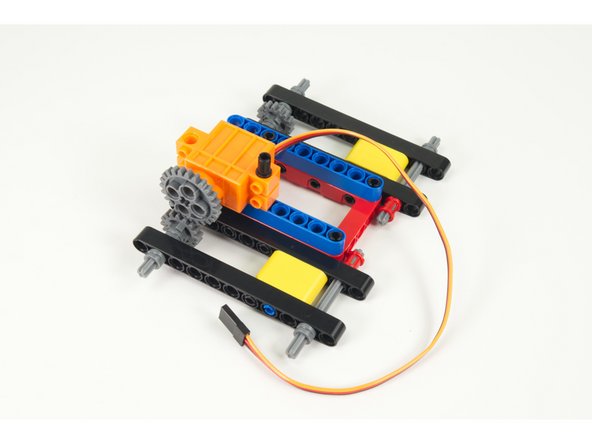 Add the left servo to the frame.