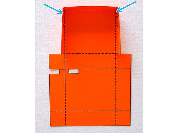 Fold the top part of the body and glue the tabs in place.