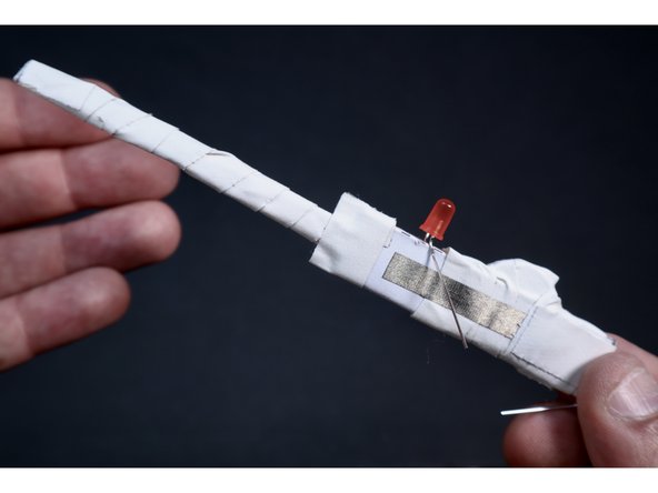 Wrap a small chunk of tape around the area where the width of the shape changes to neatly reinforce.