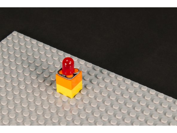 Add a stack of two 2x2 LEGO bricks.