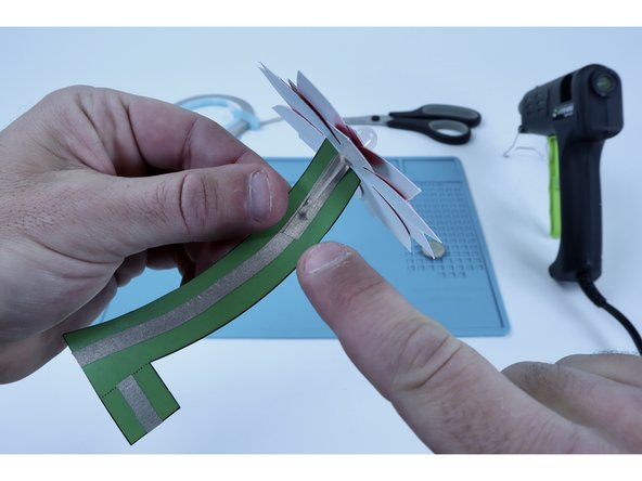 Use the remaining piece of Maker Tape to do the same to the longer LED atop the stem path on the opposite side.