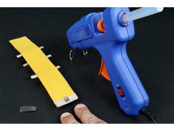 Repeat the previous step to make and place another tape loop on the remaining &quot;pad&quot;.   