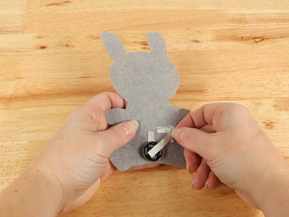 Add Maker Tape to connect the top (Positive) side of the battery to the Positive LED leg path.