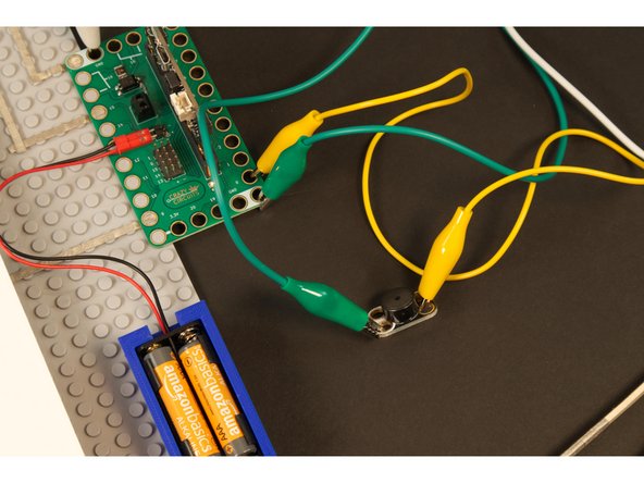 Since we've got the Bit Board hanging off the side of the LEGO baseplate, and we need to use Pin 0 and GND, we'll just add on a little 4x7 LEGO plate.