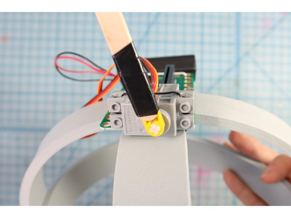 Then, we wrapped the two together with a piece of electric tape as shown.