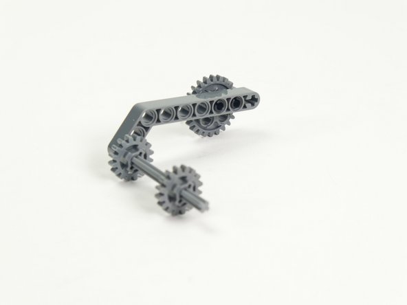 Finally, add the two smaller gears onto the axle.