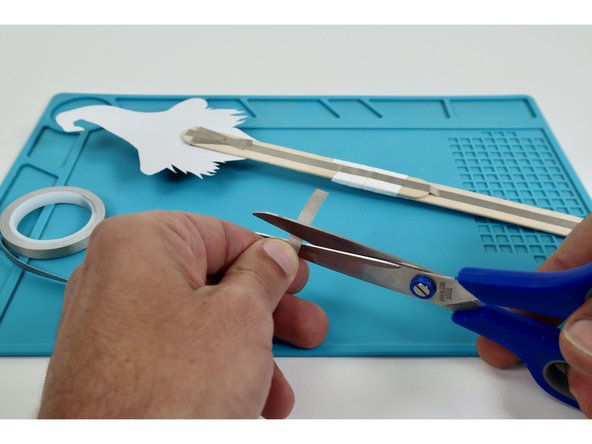 Cut a piece of Maker Tape and make one final sticky-side-out Maker Tape Loop.