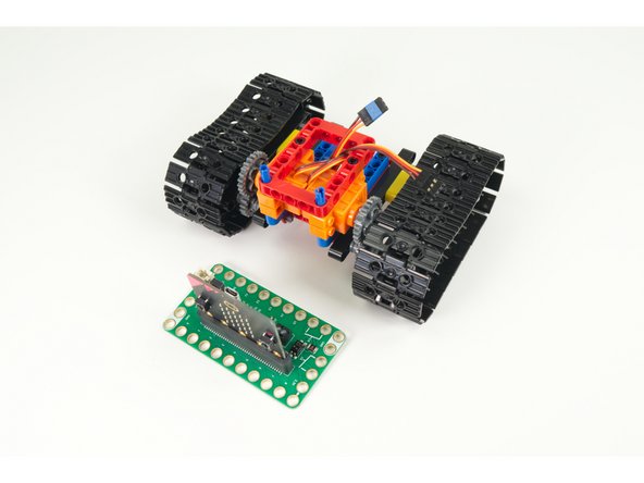 The Bit Board fits onto the two long pins sticking out of the top of the frame.