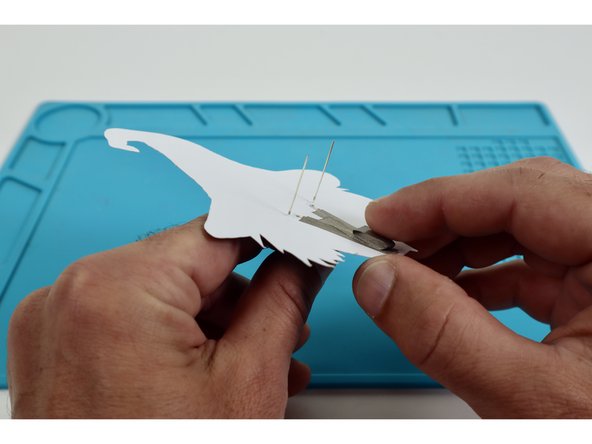 Place that tape loop atop the center of the taped area that is now atop the Long LED Legs.