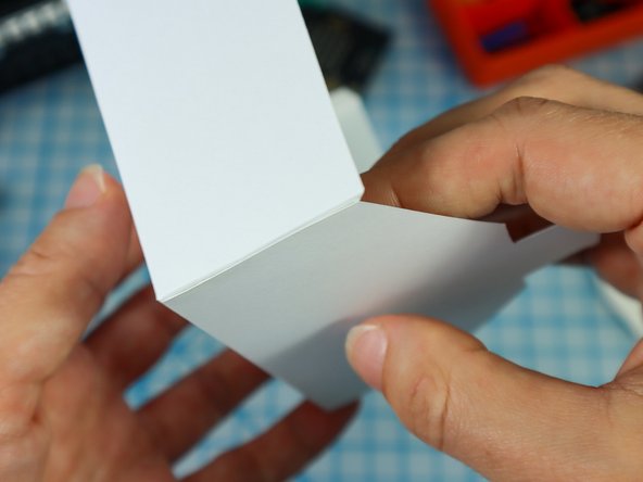 Fold each of the flaps down and apply glue to the outside.