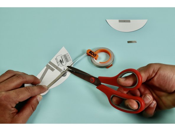 Measure, cut, peel, and stick a piece of Maker Tape down as indicated atop the letter 'A.'