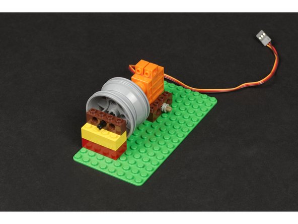 Once assembled place it on the baseplate to hold the axle in place.