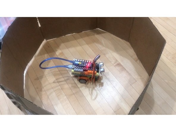 We built a simple hexagonal cardboard &quot;arena&quot; for our robot to roll around in using an old cardboard box. Feel free to get creative with what you have on hand.