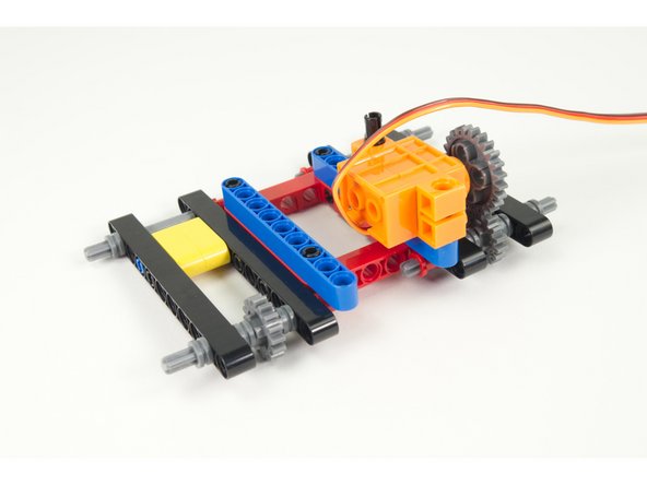 Note how the gear of the servo lines up with the gear on the axle. If it's a little bit off just slide the gear a bit on the servo shaft. (It doesn't have to be perfect!)