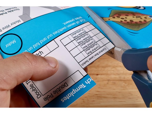 Cut and remove the remaining &quot;Control Box Lever Switch&quot; template from the upper right corner of the Flat Fish project poster. Fold it on the dotted line.