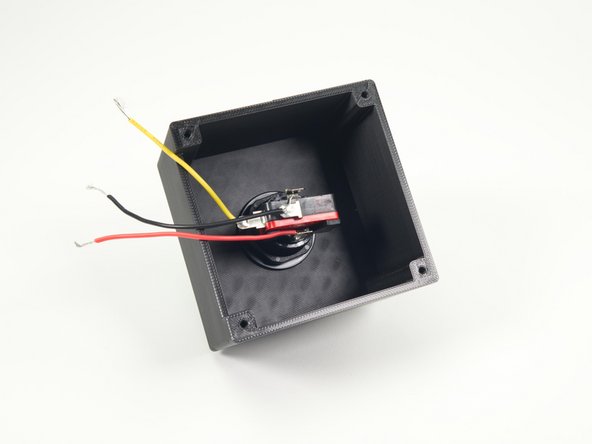 We can now add the LED/Switch to the arcade button by pushing it into place and rotating it to lock in.