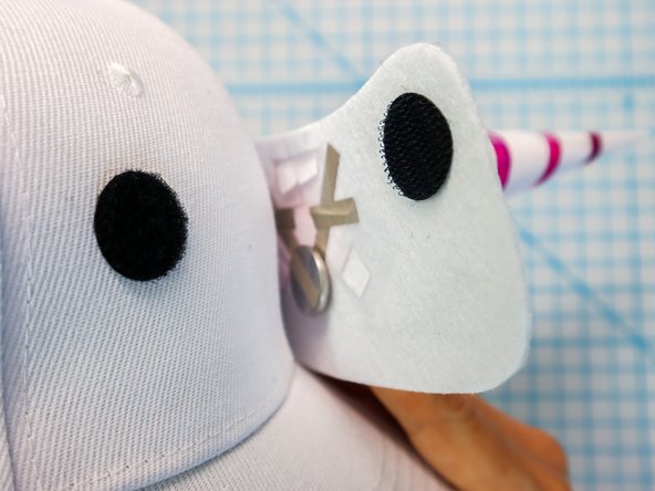 Carefully peel the hook and loop apart and squeeze each dot separately to set the adhesive.