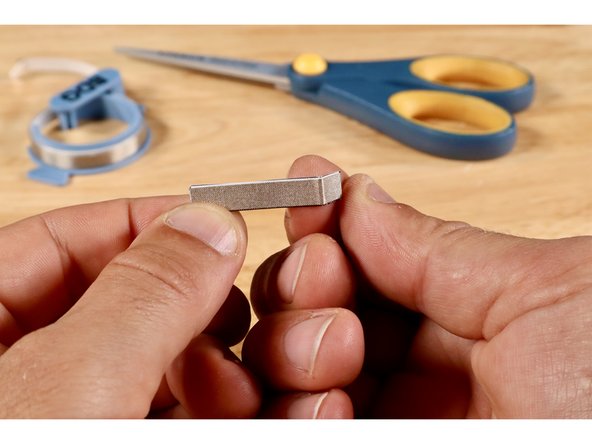 Measure, cut, peel, and stick a piece of Maker Tape where shown on the switch template.