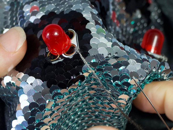 End with the thread on the inside of the shirt. DO NOT cut the thread.