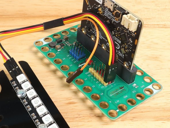 Use the Crazy Circuits Ribbon Cable to connect the NeoPixel Strip to the Bit Board.