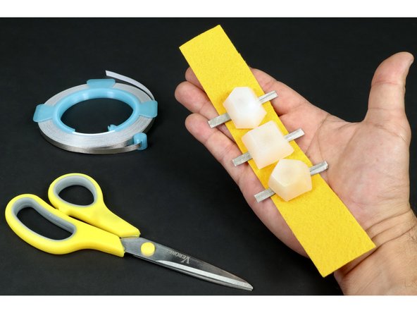 Cut 5 more pieces of Maker Tape of the same length and repeat this process for each on the remaining 5 LED legs.