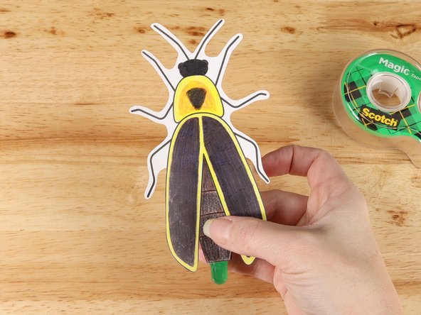 Add the Firefly template onto the clear tape loop, lining up the LED and the bottom of the Firefly.