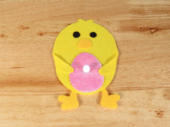 If you are using Elmers or Tacky glue, you will need to use something to hold the wings in place until it dries. Binder clips work well for this.