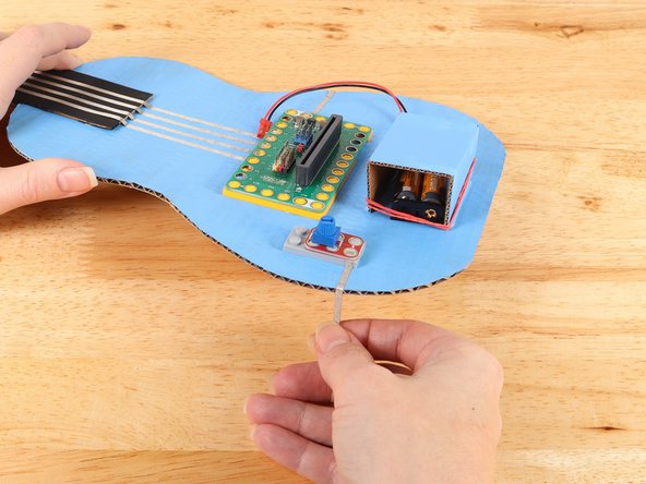 Replace the potentiometer to help secure the tape path in place.