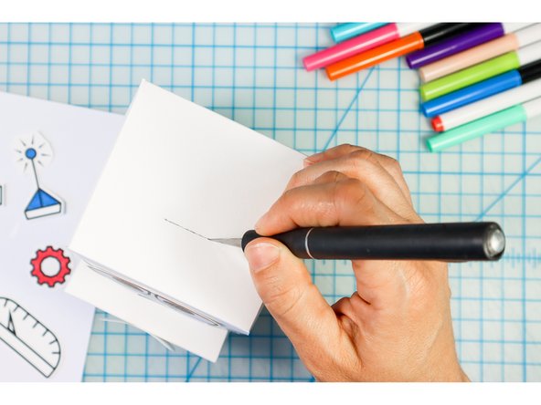 Place a slit in the Bot's head where the embellishment should go.