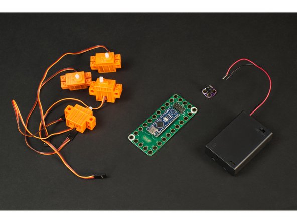 We're going to use our Robotics Board, along with 4 LEGO Compatible 360 Degree Servos, and power it with a 3 AA Battery Pack. (We'll use a Screw Terminal Chip to connect the power to the board.)