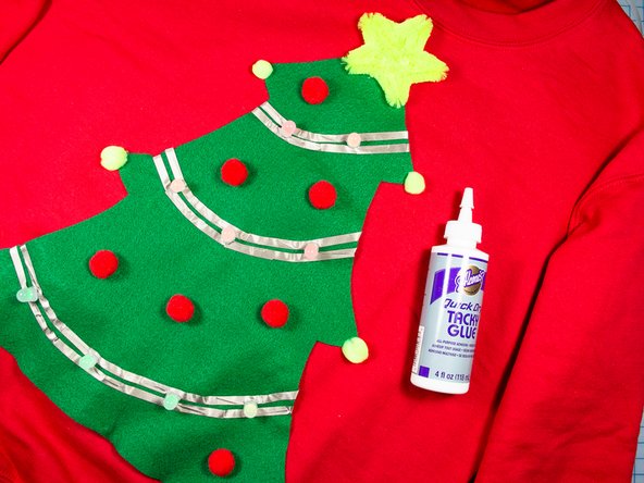 Use tacky glue (or hot glue) to attach the star and pom-pom details