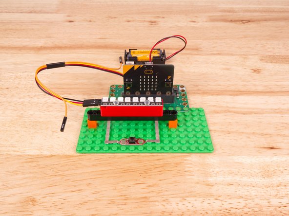 So let's get connected! If you turn the NeoPixel Strip over you'll see labels for the three pins. You should see IN, VCC, and GND.