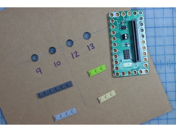 Position the bit board so that Pins 9-13 are facing the holes.