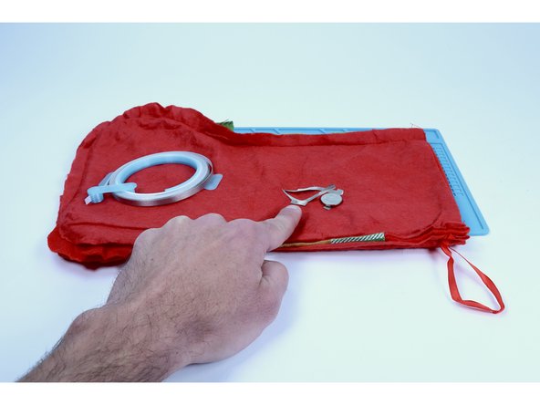 Measure, cut peel and stick one final piece of Maker Tape as shown. It should be able to reach from the remaining LED leg to the top of the battery. Connect one end of it to the remaining LED leg pathway so that the rest of that new piece is oriented toward the battery.