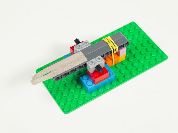 Add two more strips of Maker Tape, again leaving enough at the end to wrap around to the bottom of the beams.