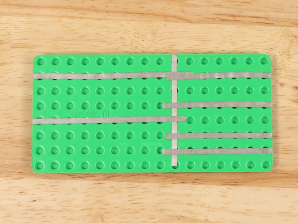 In order to fit all of the components onto one baseplate, all paths leading to Ground (GND) wrap around the edge and run along the bottom side of the baseplate.