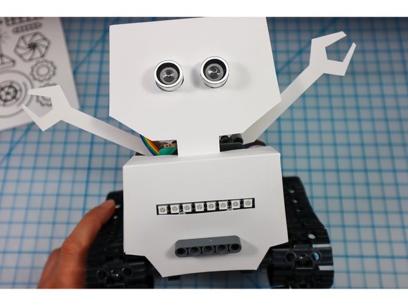 If the eyes fall out of place easily, add a piece of tape to the inside. 