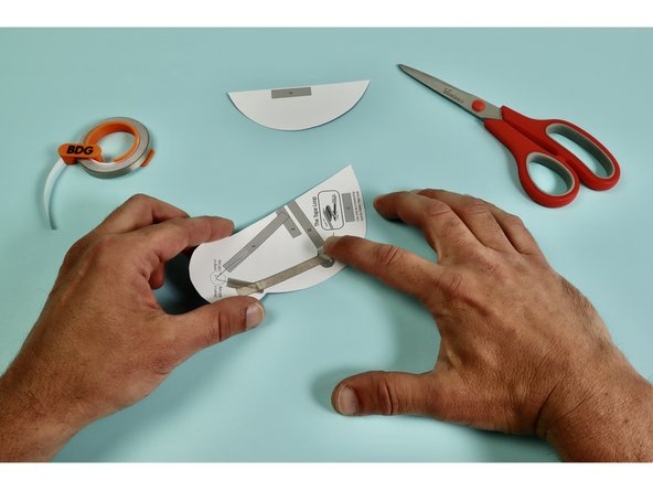 Measure, cut, peel, and stick a piece of Maker Tape down as indicated atop the letter 'B.'