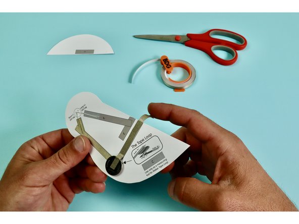 Measure, cut, peel, and stick a piece of Maker Tape down as indicated atop the letter 'D.' and press the tape down atop the Battery.