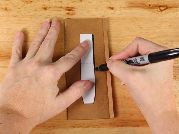 Use the template to trace the handle onto a piece of cardboard.