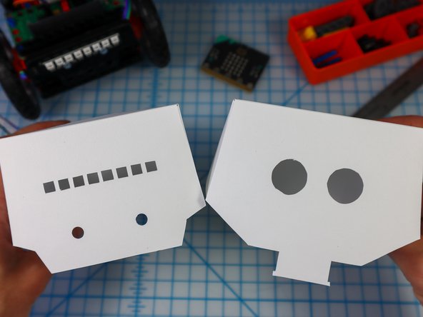 Glue the flaps on the inside of each corner as shown to create both the head and the body.