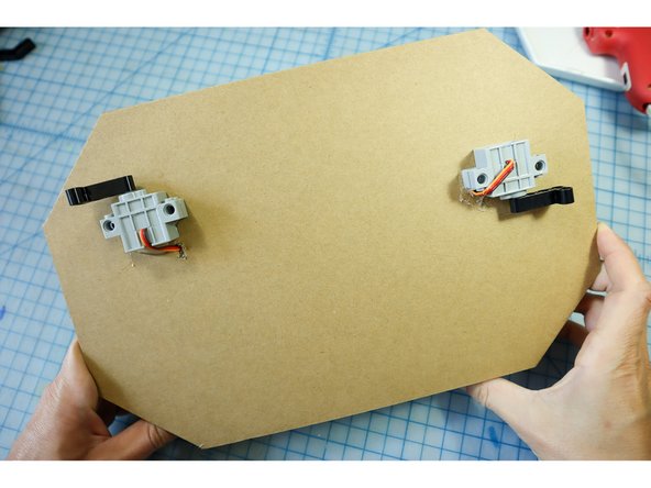 Use hot glue to glue the motors in place.