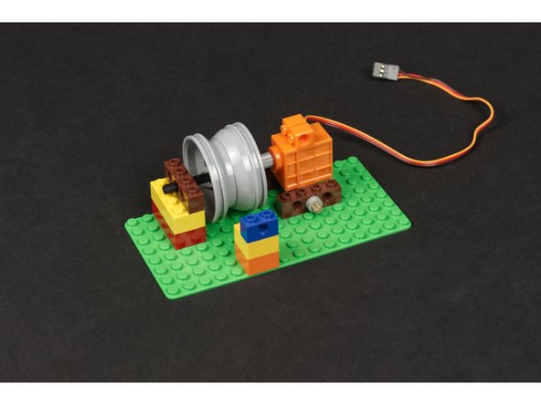 Line it up with the wheel/rim as close as you can, then slide the wheel/rim so it is centered to match the guide hole.