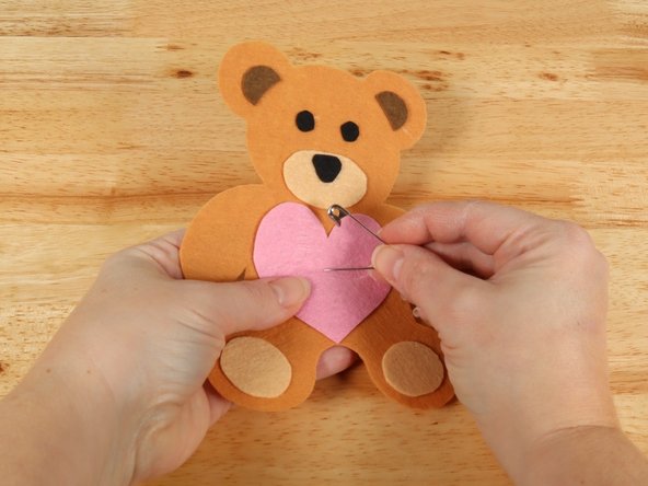 Use a safety pin or a push pin to poke two holes through the felt for the LED legs to go through.