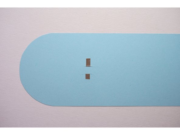 Repeat with the other slit so there are two pieces of Maker Tape